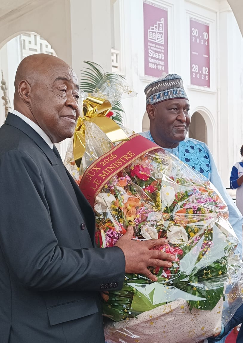 The SG presents a bouquet of flower to MINAC on behalf of the personnel